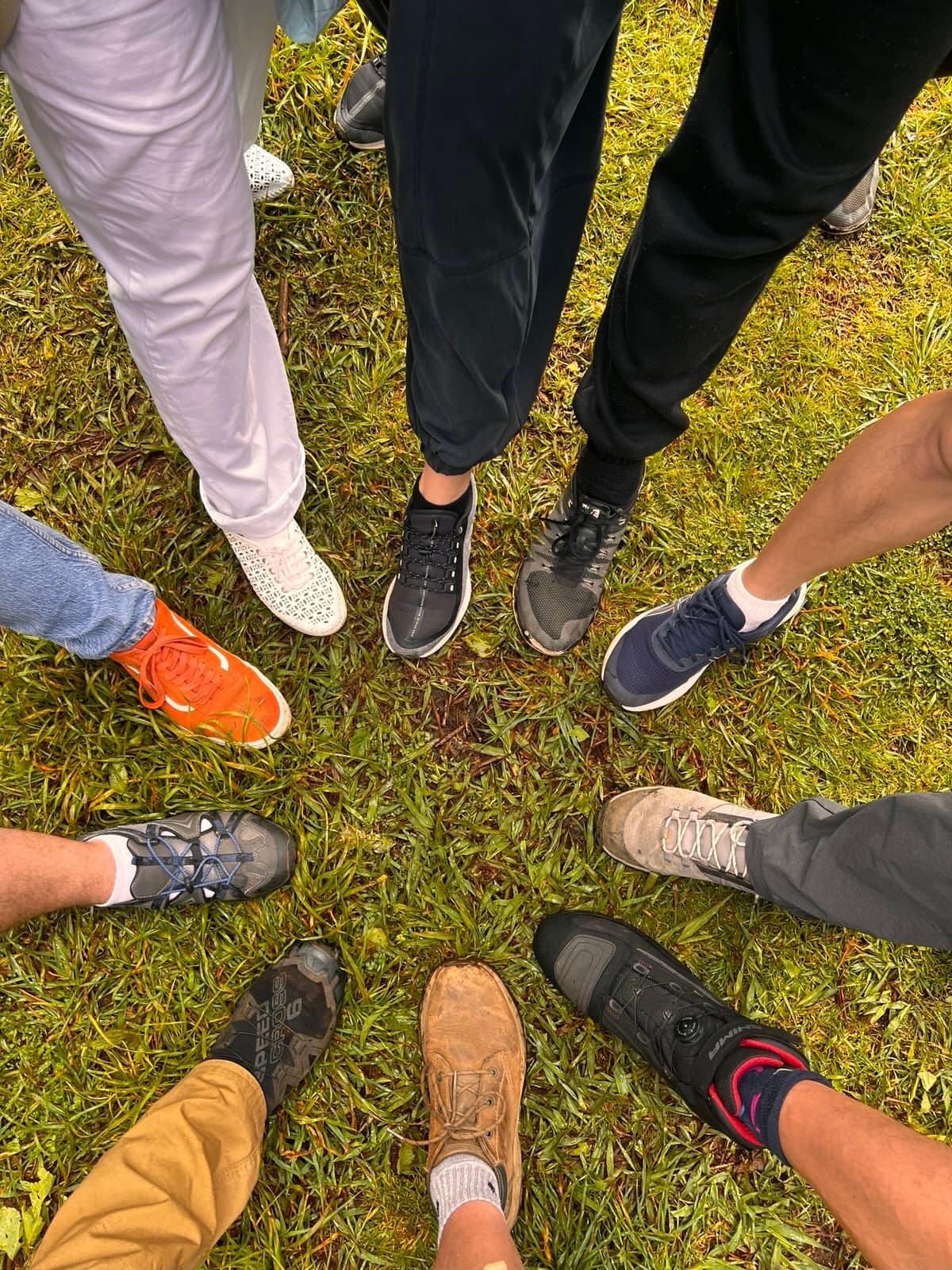 BitcoinWalk friends gathering their feet in a circle
